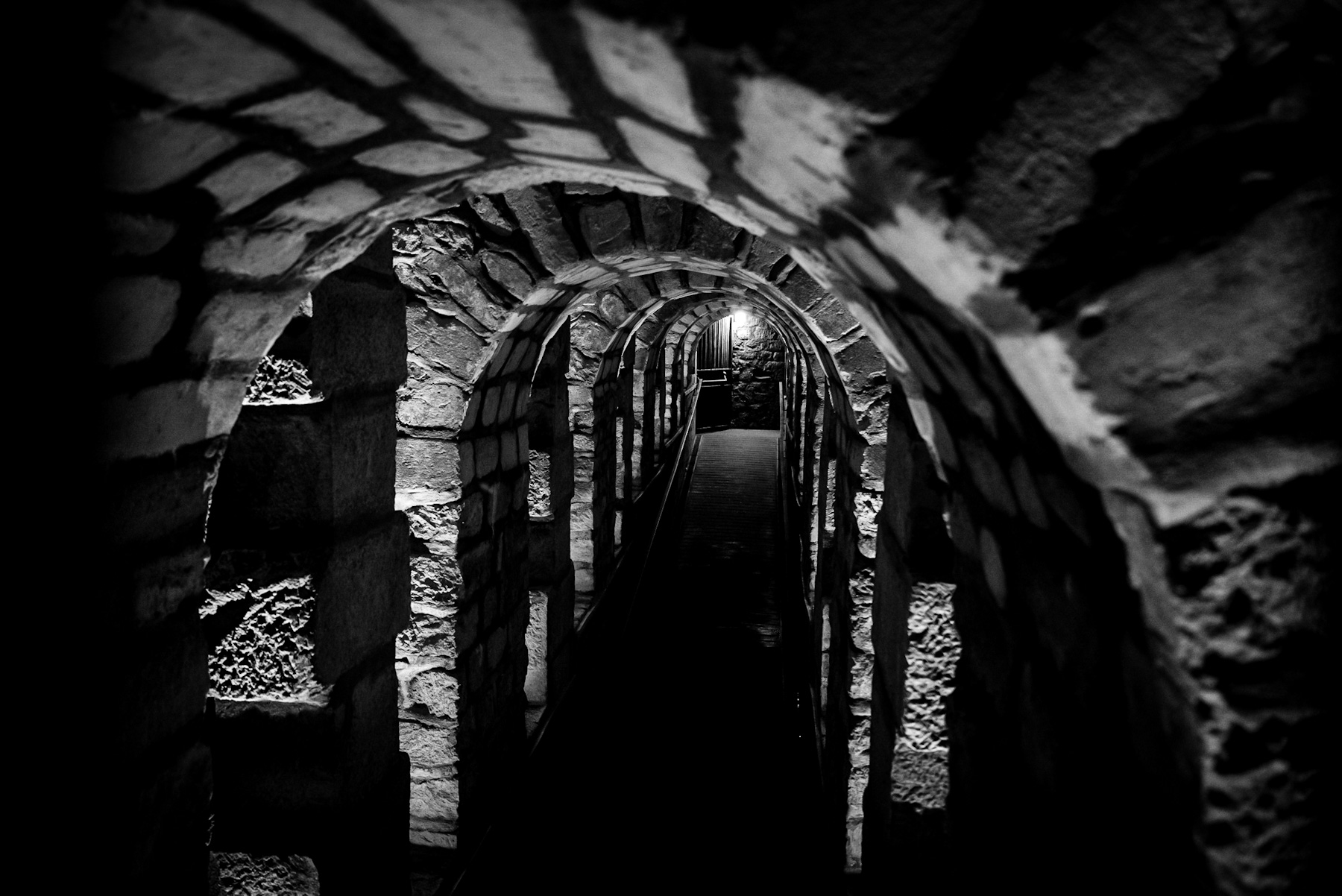 Subterranean Echoes: A Journey Through Ancient Stone Arches