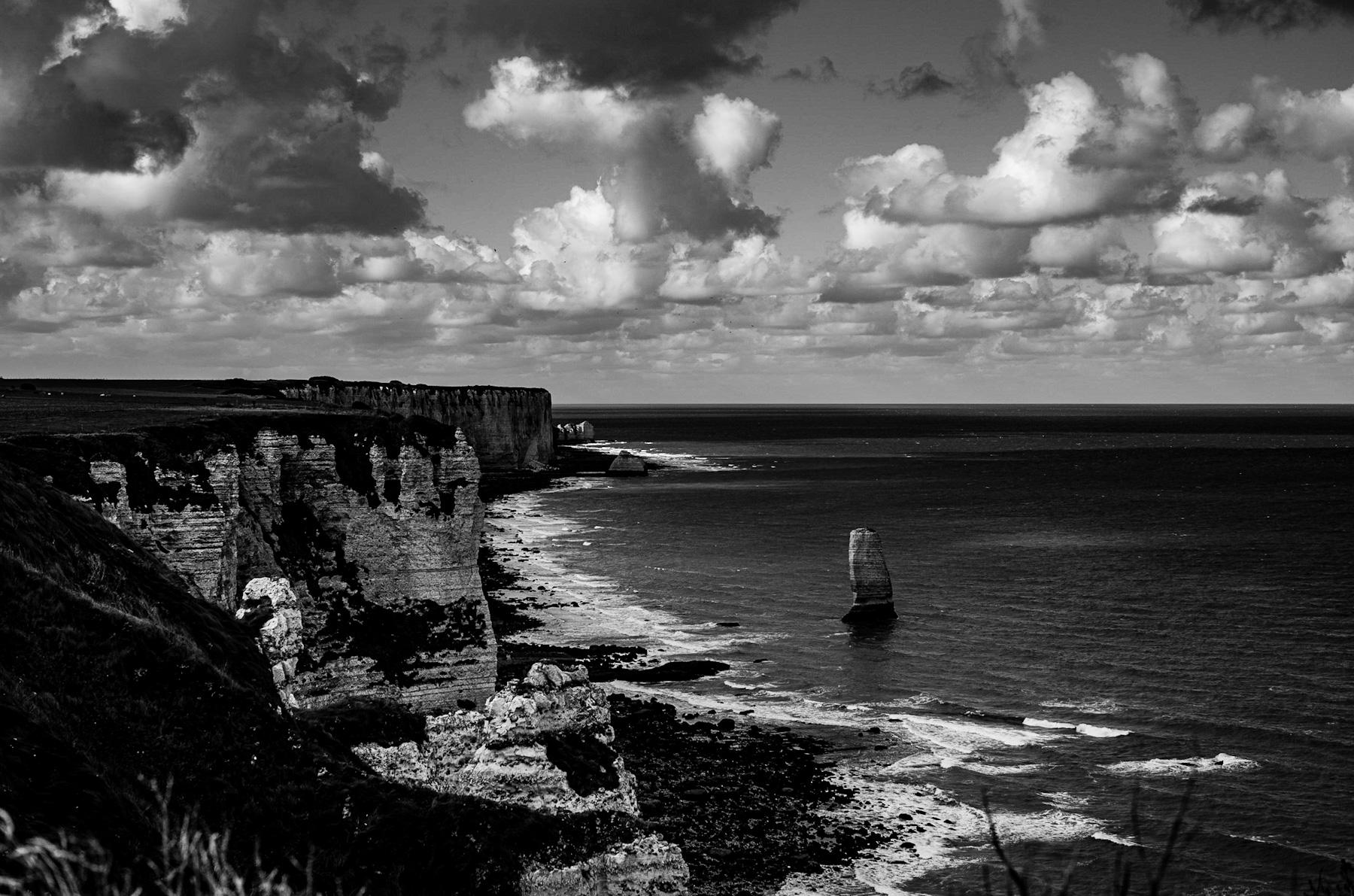 Normandy’s Enduring Majesty: A Journey Through Étretat’s Iconic Chalk Cliffs