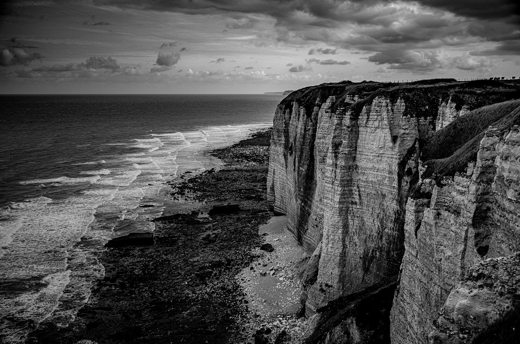 The Enduring Majesty of Coastal Cliffs: A Study in Black and White